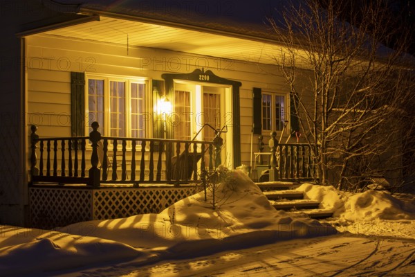 Entrance to a house lit by a lamp, Region of la Mauricie, Province of Quebec, Canada