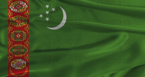 Flag of Turkmenistan with fabric textured background. Close up of National flag of Turkmenistan with realistic texture