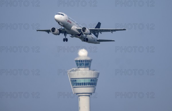 Swiss Airbus A320 aircraft takes off from Kaagbaan runway, 06/24, at Amsterdam Schiphol Airport, AMS, Air Traffic Control Tower, Netherlands