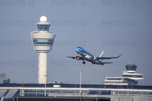 KLM Embraer ERJ-175, aircraft taking off from Kaagbaan runway, 06/24, at Amsterdam Schiphol Airport, AMS, Air Traffic Control Tower, Netherlands
