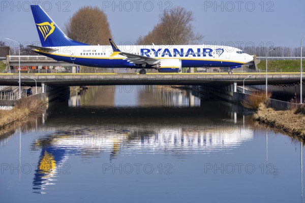 Taxiway bridge over a canal near Hoofddorp, on the Polderbaan, a runway in the west of Amsterdam Schiphol Airport, Ryanair Boeing 737 MAX 8-200, aircraft rolls to the terminal after landing, Netherlands