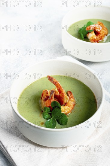 Pea cream soup, with shrimp, green soup, homemade, top view, no people