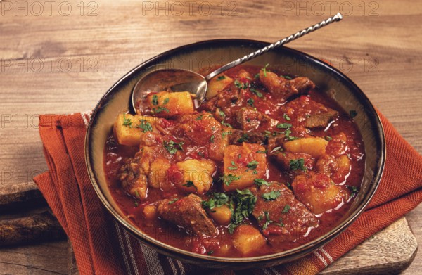 Potatoes with meat, stewed in tomato sauce, with spices and herbs, homemade, no people