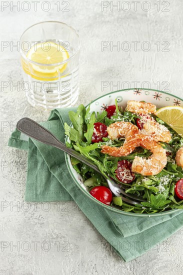 Shrimp salad with arugula and cherry tomatoes, with parmesan cheese, healthy food