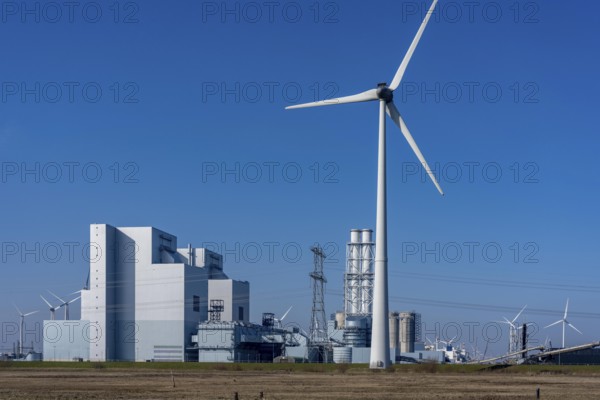 The Eemshaven coal power plant, Eemshavencentrale, operated by RWE Generation, one of the 3 large power plants in the Eemshaven energy park, has an output of up to 1.6 GW, wind farm, Groningen province, the Netherlands