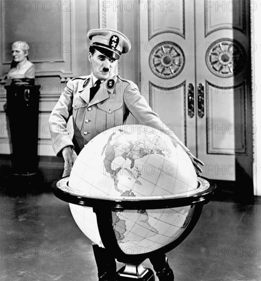 Charlie Chaplin, British actor, comedian and film producer. He is one of the most influential filmmakers of all. Here in his role in the parody about Adolf Hitler: The Great Dictator, 1940