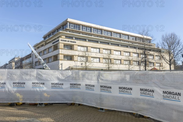 Morgan Sindall construction site screens with House of Fraser building, city centre of Plymouth, Devon, England, UK