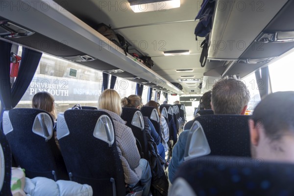 Passengers sitting onboard rail replacement bus coach, Plymouth, Devon, England, UK