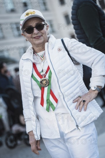 A participant in the colors of Iran at the demonstration by exiled Iranians under the motto Freedom for Iran led by Prince Reza Pahlavi in Berlin, Brandenburg Gate on 01.03.2026. The reason for the meeting is the joint attack by Iran by Israel and the USA and the resulting death of the previous leader Ali Khamenei