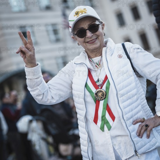 A participant in the colors of Iran at the demonstration by exiled Iranians under the motto Freedom for Iran led by Prince Reza Pahlavi in Berlin, Brandenburg Gate on 01.03.2026. The reason for the meeting is the joint attack by Iran by Israel and the USA and the resulting death of the previous leader Ali Khamenei