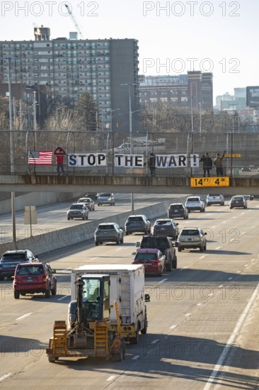 Detroit, Michigan USA - 2 March 2026 - Signs are posted on a pedestrian crosswalk over a freeway calling for an end to the U.S. wer against Iran
