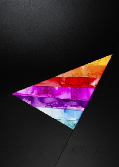 A bold triangular design featuring vibrant colors inks like orange, red, purple, and blue against a dark background. The composition is modern and dynamic, perfect for creative projects