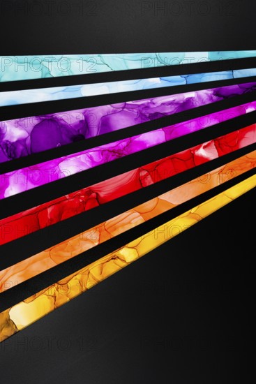 Striking diagonal streaks of vibrant colors inks including blue, purple, pink, red, and yellow contrast sharply against a black background, creating a dynamic visual impact