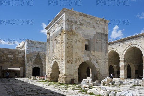 Stone building fragment and courtyard under a clear blue sky, Sultanhani caravanserai, on the former Silk Road, museum, Sultanhani Kervansaray, Sultanhani, Aksaray province, Turkey