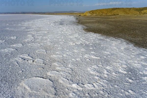 Texturally rich salt flat on the shore of a lake that ends on the horizon far away, Salt Lake, Tuz Gölü, location between Konya, Aksaray and Ankara, Turkey, Asia -