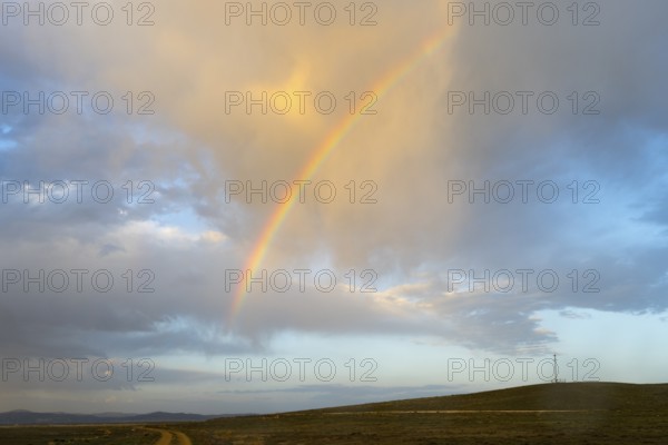 Gentle evening mood with a rainbow over open countryside and clouds at the salt lake, Tuz Gölü, location between Konya, Aksaray and Ankara, Turkey, Asia -