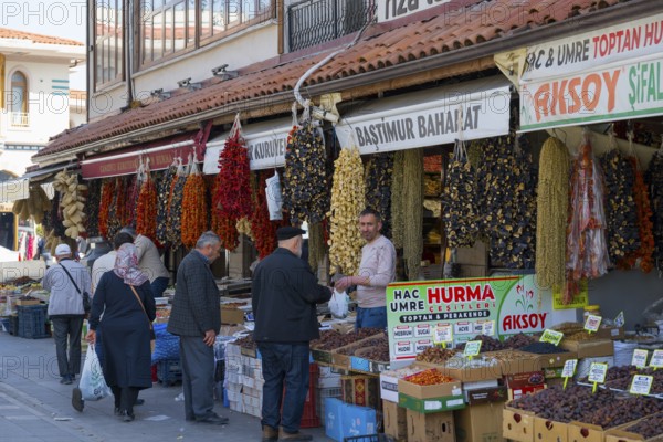 Bustling market with hanging spices and people shopping, Konya, Central Anatolia, Turkey