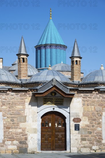 Turquoise dome on historic mausoleum nestled against a blue sky, Mevlana Museum, Mevlana, landmark, mausoleum of Mevlânâ Jalal ad-Din Rumi, Konya, Central Anatolia, Turkey