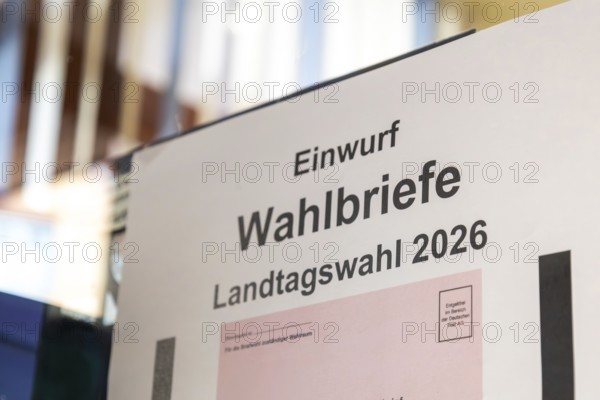 Absentee voting symbol: Sign on a municipal administration for dropping in ballot letters