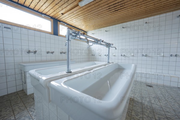 A bright laundry room with spacious sinks and several faucets, Schlehengäu Grund Schule Gechingen, Calw district, Germany