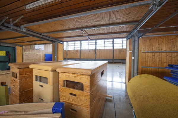 Storage room in a gym with stored sports equipment and wooden paneling, Schlehengäu Grund Schule Gechingen, Calw district, Germany