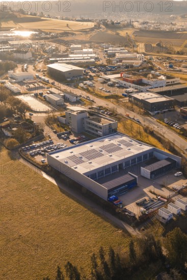 Aerial view of industrial landscape with buildings, fields and roads at sunset, Calw, Calw district, Germany