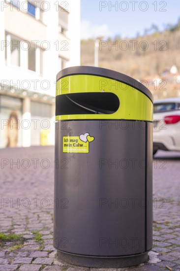 Modern trash can in an urban environment with buildings in the background, Calw, Calw district, Germany
