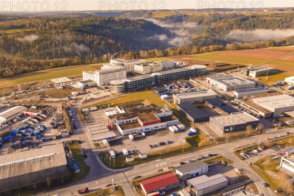 Industrial area surrounded by forest and hills with urban features, new hospital at Calw Health Campus, Calw district, Germany