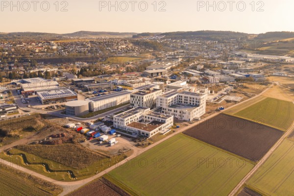 Large urban and industrial area in the middle of a hilly region, new hospital at the Calw health campus, Calw district, Germany