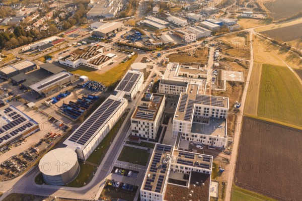 Aerial view of a modern industrial plant surrounded by city and nature, new hospital at the Calw health campus, Calw district, Germany