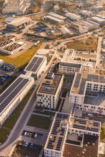 Urban aerial view with solar panels and industrial buildings, new hospital at Calw Health Campus, Calw district, Germany