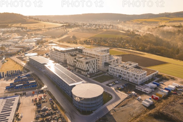 Aerial view of a large industrial area in a hilly landscape, new hospital at the Calw health campus, Calw district, Germany