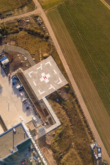 Aerial view of a helipad next to a path and agricultural fields, new hospital at Calw Health Campus, Calw district, Germany