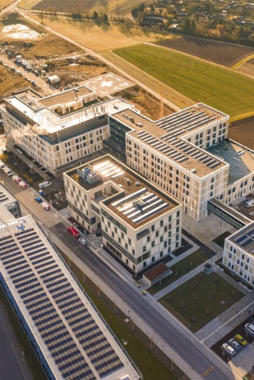 Modern architecture using solar energy in an urban facility surrounded by fields, new hospital at Calw Health Campus, Calw district, Germany