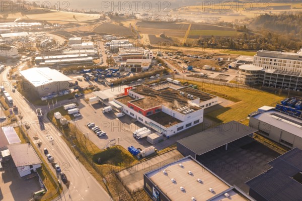 Industrial area with various warehouses and vehicles in an urban environment, new hospital at the Calw health campus, Calw district, Germany