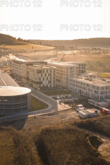 Modern architecture in rural surroundings with small fields and rolling hills, new hospital at the Calw health campus, Calw district, Germany