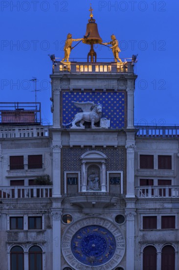 Two bronze figures ring the bell on the clock tower, dawn, Venice, Veneto, Italy