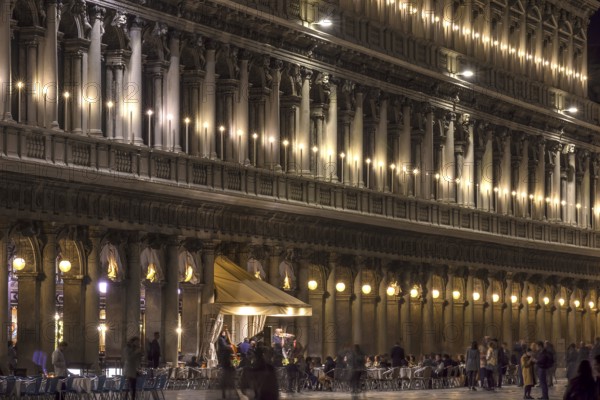 Music band in the evening on St. Mark's Square under the arcades of the Procuraties, Venice, Veneto, Italy