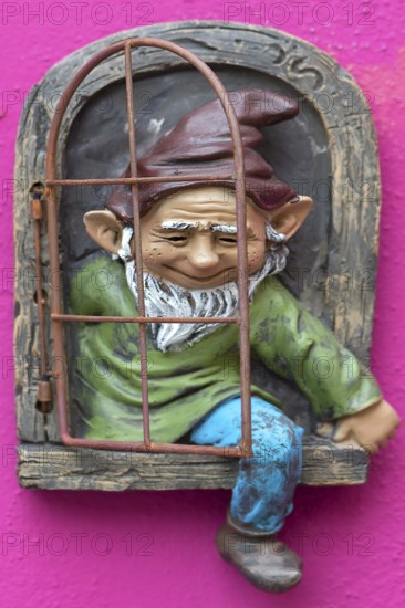 Garden gnome on a house wall, Burano, Veneto, Italy