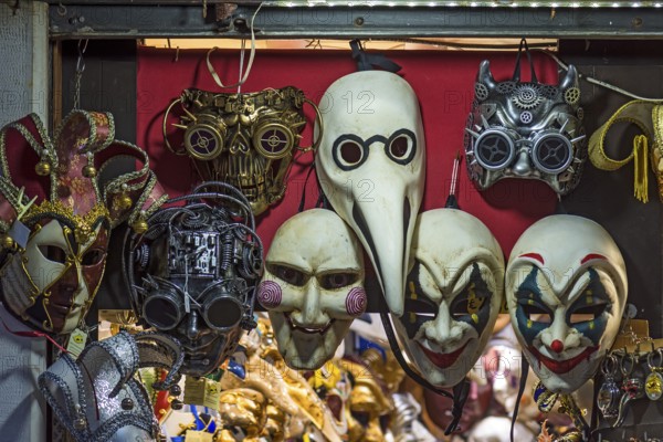 Venetian carnival masks in a shop window, Venice, Veneto, Italy