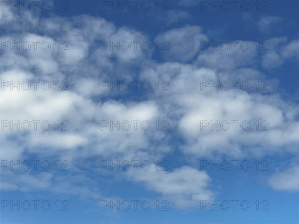 Medium-high white clouds Altocumulus Sheep clouds in good weather on a blue sky, international