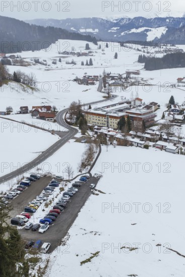 Snow scenario in a small village with parking lots and roads taken from the air, specialist clinic for psychosomatics and psychotherapy, Hochgrat Clinic, Stiefenhofen, Bavaria, Germany