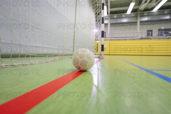 A handball is on a red stripe close to a goal in a hall, handball, Calw, Germany