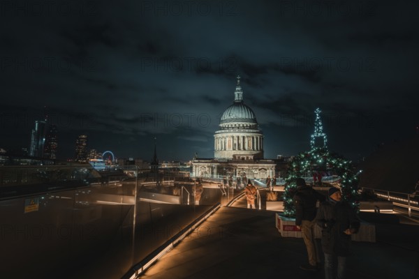 View of London with illuminated St. Paul's Cathedral and festive decor at night, London, Great Britain