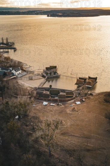 Traditional stilt houses on the water at a calm sunset, surrounded by natural beauty, stilt houses Unteruhldingen, Bodenseekreis, Germany