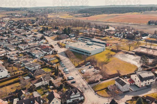 Bird's eye view of a village with buildings and natural fields in the background, Ötisheim, Enzkreis, Germany