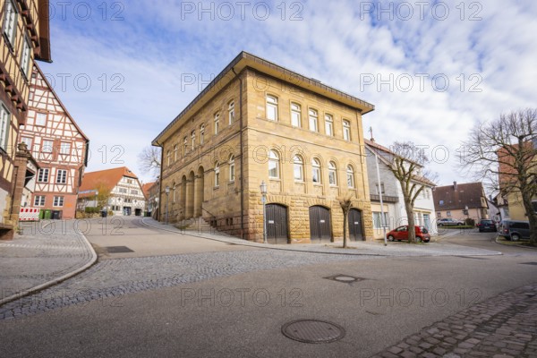 Historic sandstone building on a paved street in a quiet town, Ötisheim, Enzkreis, Germany