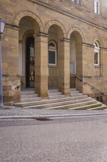 Building with stone arches and steps, typical entrance of a historic structure, Ötisheim, Enzkreis, Germany