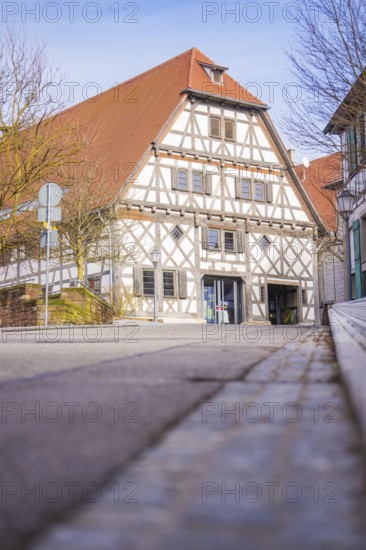 Historic half-timbered house on a quiet street in sunny spring weather, Ötisheim, Enzkreis, Germany