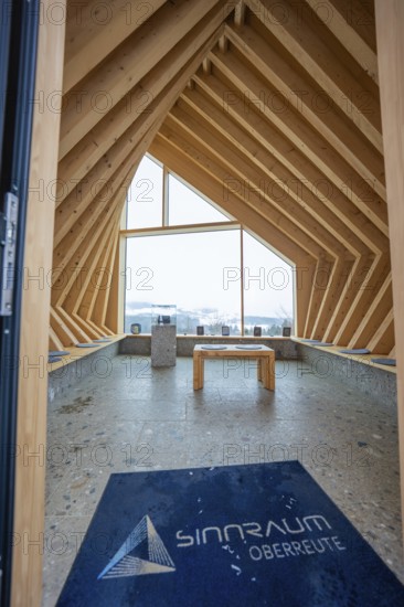Modern interior with wooden elements and large window with views of nature, Sinnraum, Oberreute, Allgäu, Bavaria, Germany